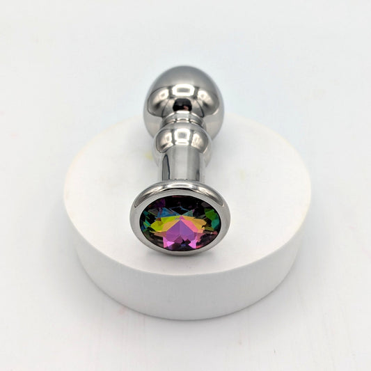 Tapón anal con joyas de acero inoxidable y cuerpo redondeado.